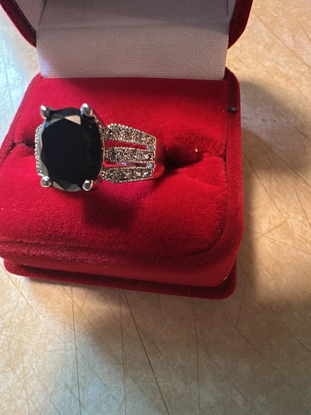 Silvertone  Ring with Black Oval Stone and Pavé Accents